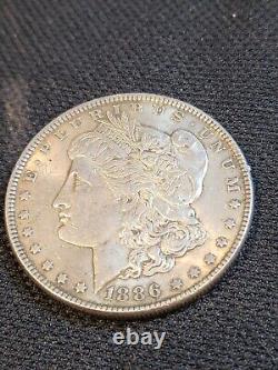 1886 Morgan Silver Dollar 90% Silver No Mint Mark 7 Feathers