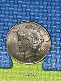 1922 Silver Peace Dollar coin, rare and in great condition. No mint mark