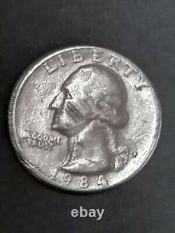 1984P Quarter Filled In Mint Mark Letters. Cud. Eagle has error