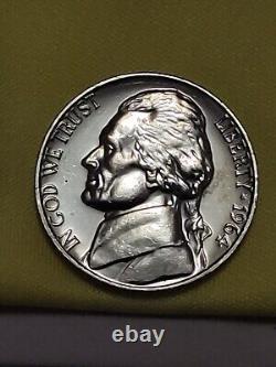 A rare 1964 special strike no mint mark FS it's silver it weighs 5.0 G very nice