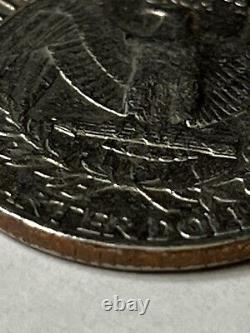 Silver 25 Cent Quarter of 1990 D, in regular condition. Botched Mint Mark